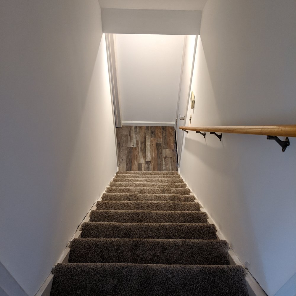 The Floor Store - a staircase leading to a second floor - Carpeting Near Me - Farmingdale, New York The Floor Store - a staircase leading to a second floor - Carpeting Near Me - Farmingdale, New York