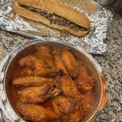 Gino's Real New York Pizza - Lg. Steak and Cheese Sub and hot wings.