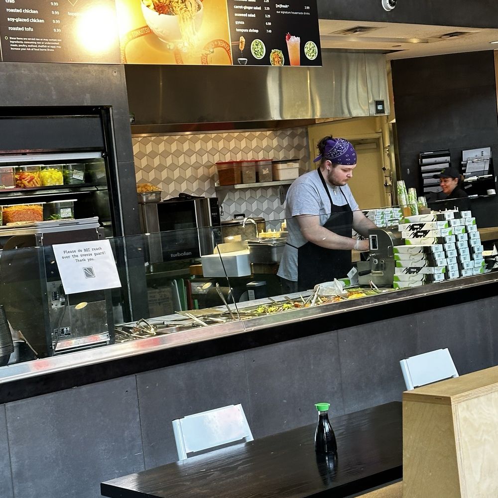 FUSIAN - a man preparing food in a restaurant - Sushi Bars Near Me - Columbus, Ohio FUSIAN - a man preparing food in a restaurant - Sushi Bars Near Me - Columbus, Ohio