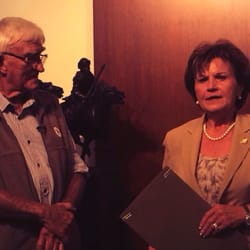 Mustang Sculpture Exhibit - Robert Glen, creator of the sculptures accepting a proclamation from the city.