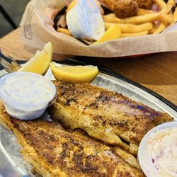 River Smith's Chicken & Catfish - Broil charred whole catfish every