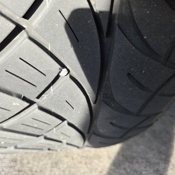 Tire World Complete Auto Repair - Nail in the tire before the fix at 12pm. Notice the full tread on the entire tire - Auto Repair Near Me - Inglewood, California Tire World Complete Auto Repair - Nail in the tire before the fix at 12pm. Notice the full tread on the entire tire - Auto Repair Near Me - Inglewood, California