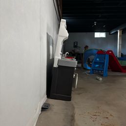 floor concrete and wall done by Woodford Bros. Leaning childs toy floor concrete and wall done by Woodford Bros. Leaning childs toy
