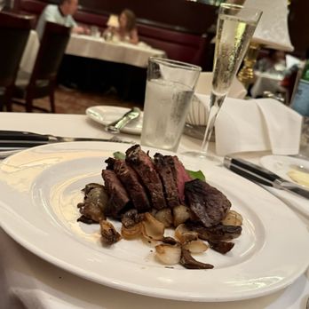 The Capital Grille - Sliced Filet Mignon with Cipollini Onions, Wild Mushrooms and Fig Essence - Steakhouses Near Me - Charlotte, North Carolina The Capital Grille - Sliced Filet Mignon with Cipollini Onions, Wild Mushrooms and Fig Essence - Steakhouses Near Me - Charlotte, North Carolina
