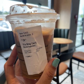 Starbucks - a hand holding a cup of iced coffee - Coffee & Tea Near Me - North Providence, Rhode Island Starbucks - a hand holding a cup of iced coffee - Coffee & Tea Near Me - North Providence, Rhode Island
