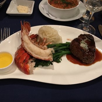 Narcoossee's - Butter poached lobster tail and filet mignon with red wine-oxtail reduction - delicious!! - New American Near Me - Lake Buena Vista, Florida Narcoossee's - Butter poached lobster tail and filet mignon with red wine-oxtail reduction - delicious!! - New American Near Me - Lake Buena Vista, Florida