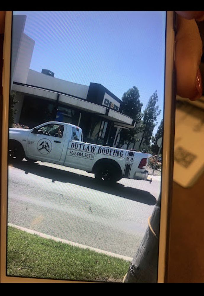 Slide of Outlaw Roofing