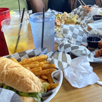 Sundogs Raw Bar & Grill - Po Boy shrimp sub, boneless hot wings, chicken nachos. - American Near Me - Corolla, North Carolina Sundogs Raw Bar & Grill - Po Boy shrimp sub, boneless hot wings, chicken nachos. - American Near Me - Corolla, North Carolina