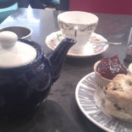 Pot of tea and fruit scone