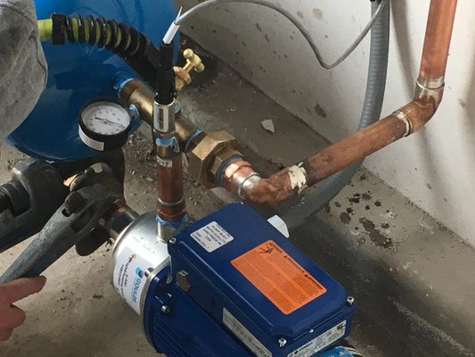 Booster pump - This is an example of a residential booster pump installation in a garage. This condo did not have enough water pressure to feed the fire sprinkler system on the 3rd floor. This pump was installed to assist with that as well as the overall water pressure in the condo. Booster pump - This is an example of a residential booster pump installation in a garage. This condo did not have enough water pressure to feed the fire sprinkler system on the 3rd floor. This pump was installed to assist with that as well as the overall water pressure in the condo.