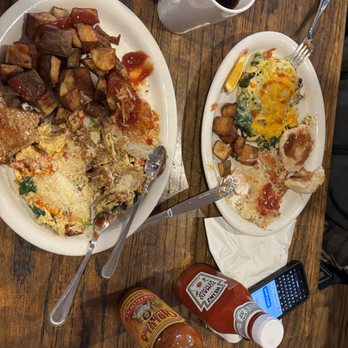 West Coast Diner - 2 of the Breakfast Scrambles, with different choices for spuds, cheeses and meats, love that their hot sauce is larger than ketchup! Yum! - Breakfast & Brunch Near Me - Portland, Oregon West Coast Diner - 2 of the Breakfast Scrambles, with different choices for spuds, cheeses and meats, love that their hot sauce is larger than ketchup! Yum! - Breakfast & Brunch Near Me - Portland, Oregon