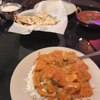 India Clay Oven - Chicken Tikka Masala, Garlic Naan, and Red Curry Chicken both dishes extra spicy! - Indian Near Me - Branson, Missouri