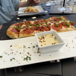 Bacon, Jalapeno Flatbread and beef empanada Bacon, Jalapeno Flatbread and beef empanada