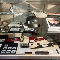 Paul's Antiques & Collectibles - This photo is to document the display from in my review. It is shared for transparency only, not to promote or glorify the items shown.