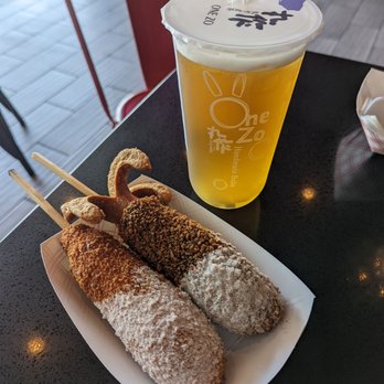 One Zo/ Myungrang Hotdog - Mozzarella sausage and squid ink mozzarella dogs half covered with sugar. Jasmine tea - Bubble Tea Near Me - Long Beach, California