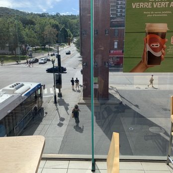 A&W - a view of a city street from a restaurant window - Fast Food Near Me - Montreal, Quebec