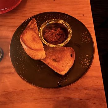 Primal Steakhouse - Sourdough bread with jam - Steakhouses Near Me - The Colony, Texas Primal Steakhouse - Sourdough bread with jam - Steakhouses Near Me - The Colony, Texas