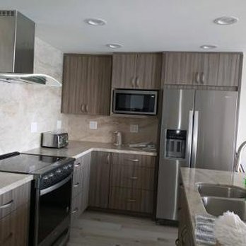 Kitchen Cabinets Express - Kitchen. At Ocean. Went with laminate cabinets because of salt air. Ammar's suggestion. Great suggestion. Also,full quartzsite backsplash. - General Contractors Near Me - Buena Park, California