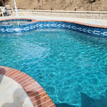 Trinity Custom Pools - We love the color of the NPT Stonescape Carribean Blue mini pebble finish - Pool & Hot Tub Service Near Me - Riverside, California