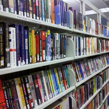 Rancho Cucamonga Public Library - One of the shelves of used books at the excellent Friends of the Library bookstore. They also sell used puzzles, CDs, and DVDs. - Libraries Near Me - Rancho Cucamonga, California