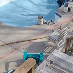 Picture Perfect Pools - New, beautiful, light blue plaster bottom being applied.