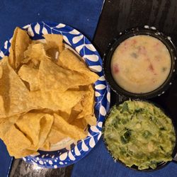 Hermanos Locos Tacos - Chips and guacamole with side of queso