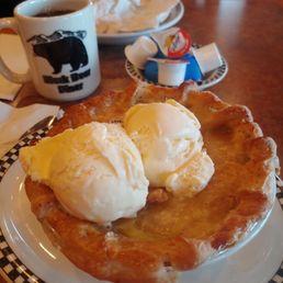 Apple pie a la mode with coffee.