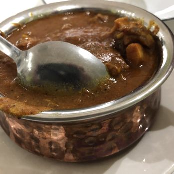 Tanjore North Indian Cuisine - Goat curry, bone-in. - Indian Near Me - Belleville, Ontario Tanjore North Indian Cuisine - Goat curry, bone-in. - Indian Near Me - Belleville, Ontario