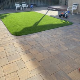 a backyard with artificial grass a backyard with artificial grass