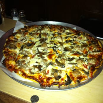 Elmer's Place - a pizza with mushrooms and cheese - Beer, Wine & Spirits Near Me - Redgranite, Wisconsin