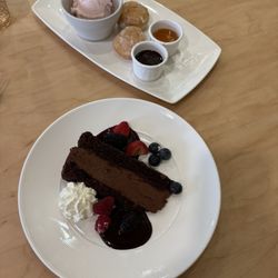 Illyria - Loukoumades (Beignets) with pistachios, honey, & strawberry ice cream; Sinful chocolate mousse cake with berries and dark chocolate sauce