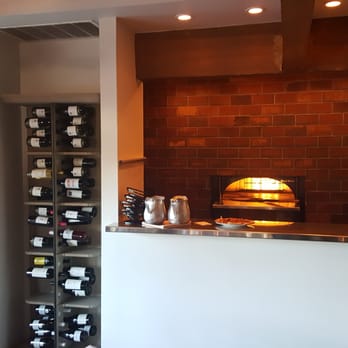 Winslow's - Kitchen window, lined in wine, featuring the wood stone oven - New American Near Me - Fort Worth, Texas Winslow's - Kitchen window, lined in wine, featuring the wood stone oven - New American Near Me - Fort Worth, Texas
