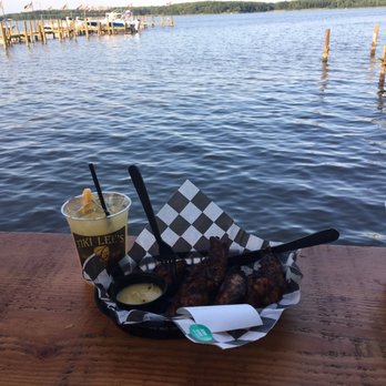 Tiki Lee's Dock Bar - $5 happy hour crush and jerk chicken. What else do you need? - New American Near Me - Sparrows Point, Maryland Tiki Lee's Dock Bar - $5 happy hour crush and jerk chicken. What else do you need? - New American Near Me - Sparrows Point, Maryland