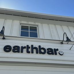 Signage with the earthbar signature logo.