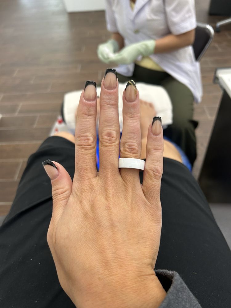 New Vision Nails & Day Spa Logo