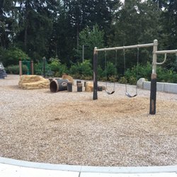 Bridle Trails Corner Park - Small but clean and well kept playground. Lots of faux rocks and tree stumps to climb on.