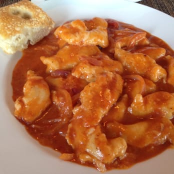 Oltre Mare - Salted focaccia bread alongside the homemade ricotta gnocchi with onions in a tomato sauce - makes me hungry thinking about the flavors - Italian Near Me - San Diego, California
