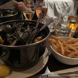 a bowl of mussels and fries a bowl of mussels and fries