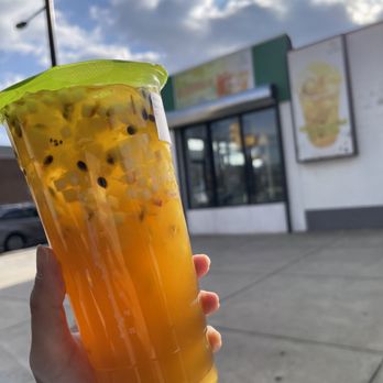 Mister Wish - a hand holding a plastic cup filled with orange juice - Bubble Tea Near Me - San Leandro, California Mister Wish - a hand holding a plastic cup filled with orange juice - Bubble Tea Near Me - San Leandro, California