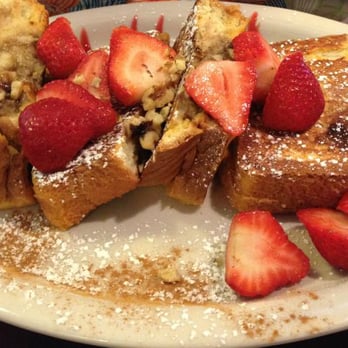 Javier's Café - Stuffed Banana Walnut French Toast with strawberries on top. - Breakfast & Brunch Near Me - Smithtown, New York Javier's Café - Stuffed Banana Walnut French Toast with strawberries on top. - Breakfast & Brunch Near Me - Smithtown, New York