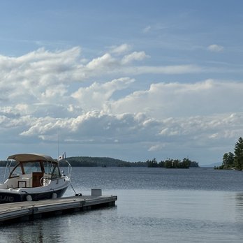 Dockside Inn & Tavern - a boat docked at a dock - American Near Me - Greenville, Maine Dockside Inn & Tavern - a boat docked at a dock - American Near Me - Greenville, Maine