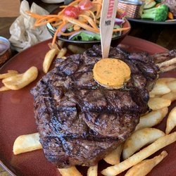 Volcano's steakhouse - OP Rib Eye 650g with chips and a salad