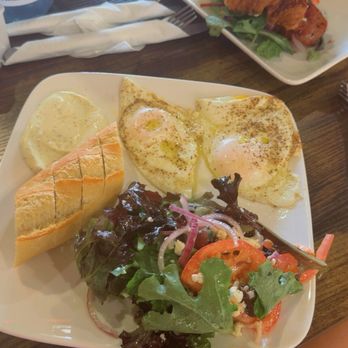 Le Caramel By Chefsetee - Happy Eggs plate and a croissant breakfast sandwich - Bakeries Near Me - Orlando, Florida