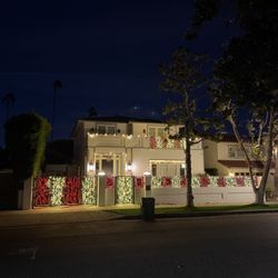 Stars Holiday Lighting - Red & white balcony, entryway, windows, & gate lights installed by Stars Holiday Lighting in Toluca Lake, CA