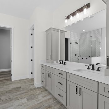 Portfolio Homes Construction - a large bathroom with double sinks - General Contractors Near Me - Melbourne, Florida Portfolio Homes Construction - a large bathroom with double sinks - General Contractors Near Me - Melbourne, Florida