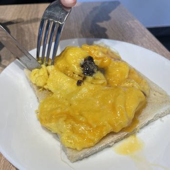 Cafe De Hong Kong - Black truffle scrambled egg on toast (came with the Meal D in the All Day breakfast) $8.79 - Hong Kong Style Cafe Near Me - Markham, Ontario Cafe De Hong Kong - Black truffle scrambled egg on toast (came with the Meal D in the All Day breakfast) $8.79 - Hong Kong Style Cafe Near Me - Markham, Ontario