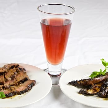 Good Wine - two plates of food and a glass of wine - Beer, Wine & Spirits Near Me - Brooklyn, New York