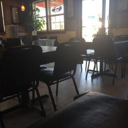 a person sitting at a table in a restaurant a person sitting at a table in a restaurant