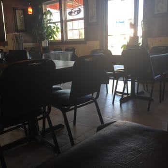 Wind Taste - a person sitting at a table in a restaurant - Chinese Near Me - Russellville, Arkansas Wind Taste - a person sitting at a table in a restaurant - Chinese Near Me - Russellville, Arkansas