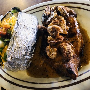 The Backyard Grill - Devils honey grilled chicken topped with cinnamon pecans and a loaded baked potato. - American Near Me - Houston, Texas